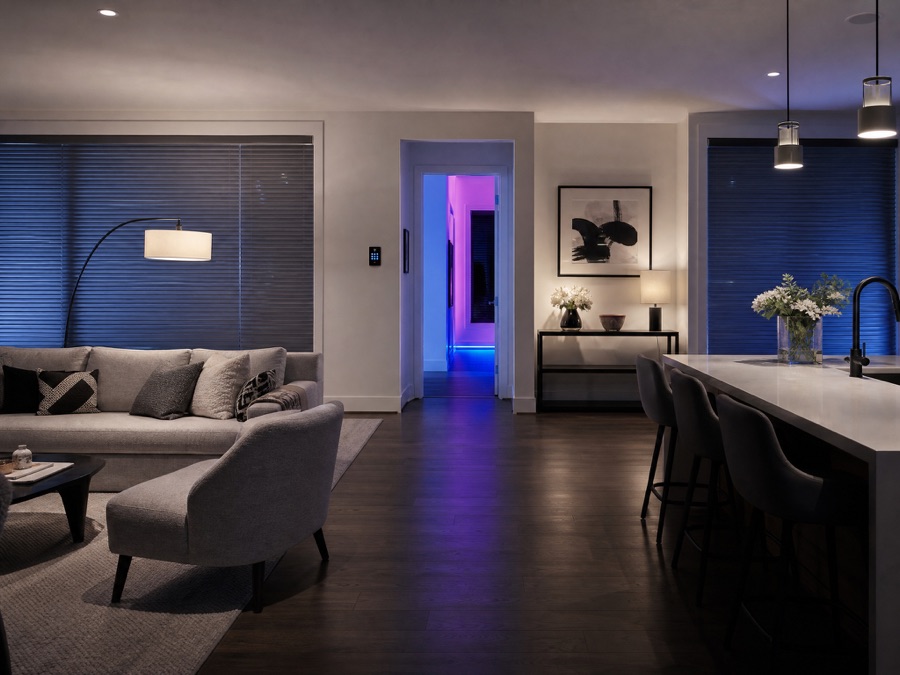 An open-plan living area with an evening lighting scene active
